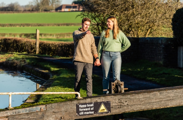 Couple walking on canal