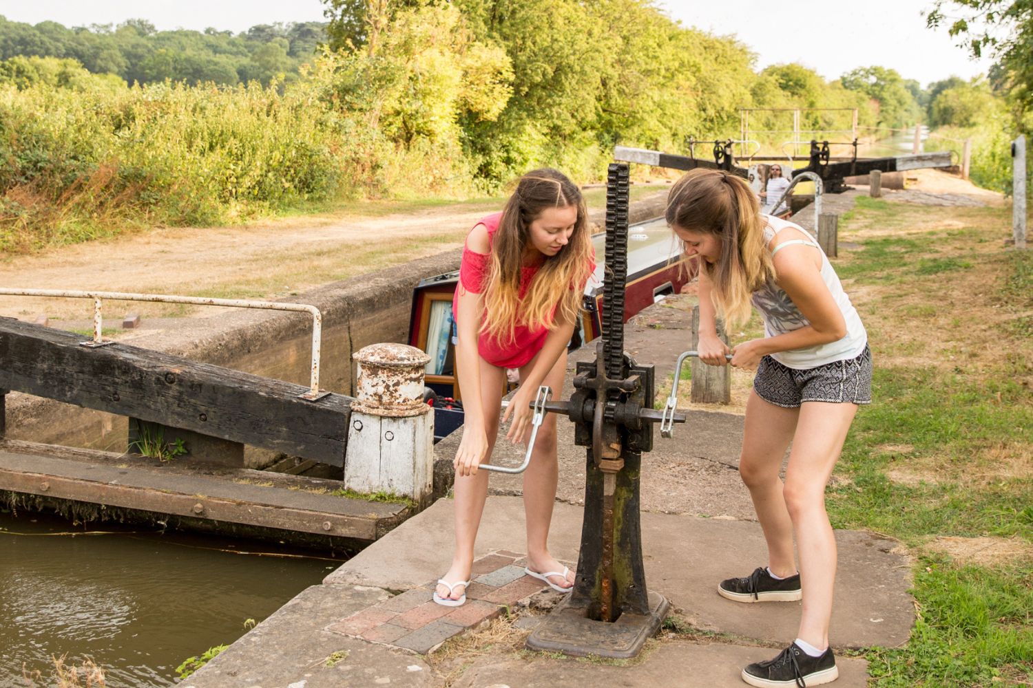 teenagers working lock on canal